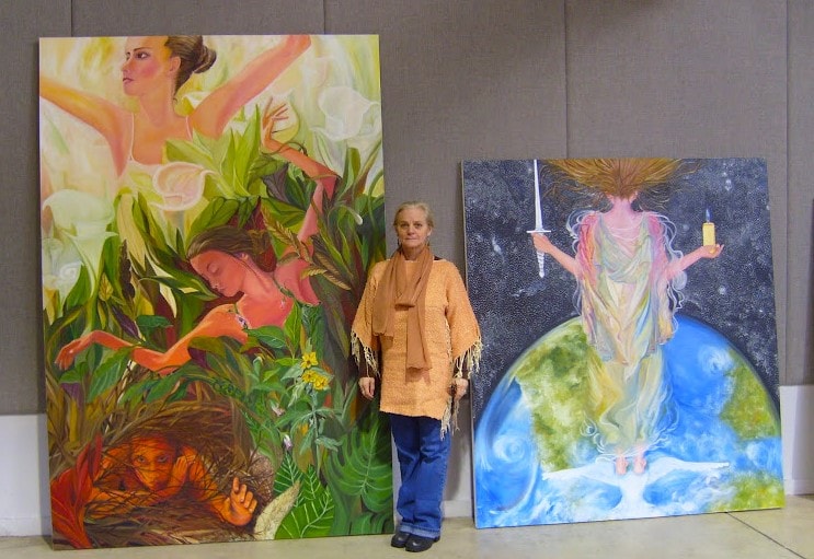 Dr. debi Story Maddox posing with Entangled to the left and Heavenly Vision on the right